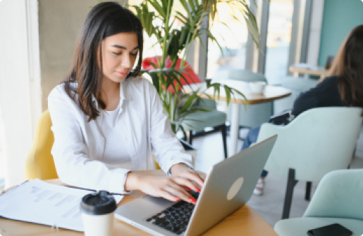 White woman working in a notebook